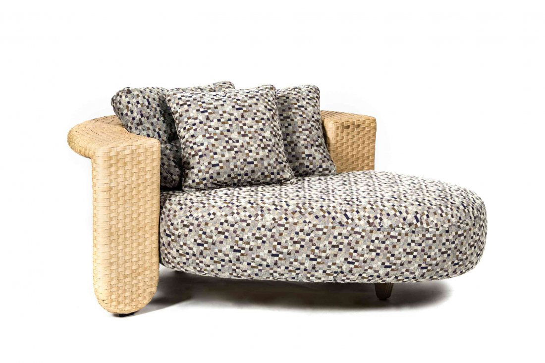 An Italian Longa Wicker and Upholstered Oval Chaise,: An Italian Longa Wicker and Upholstered Oval Chaise, the woven wicker frame fitted with a ovoid form upholstered seat, having two matching throw pillows. Height 24 1/2 x width 61 x depth 48 inches. Pr
