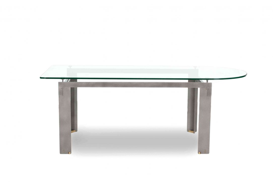 A Contemporary Metal and Glass Top Dining Table, Height: A Contemporary Metal and Glass Top Dining Table, the glass top with one D-shaped end, on stemmed metal supports and angular metal frame. Height 29 x width 78 1/2 x depth 33 1/2 inches. Property from t