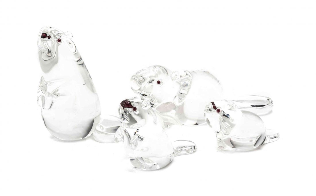 Four Steuben Glass Figures of Beavers, Height of: Four Steuben Glass Figures of Beavers, in various poses, each having colored eyes and etched Steuben on base. Height of tallest 6 3/4 inches.