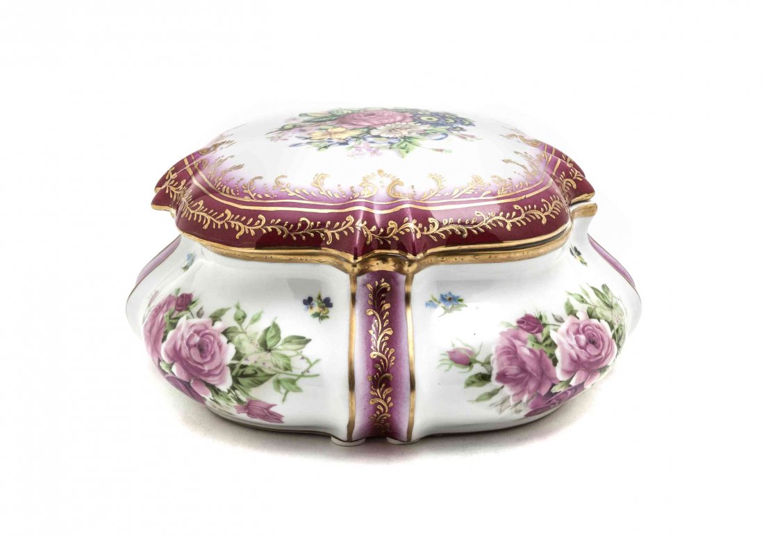 A Porcelain Lidded Serving Dish, Length 10 1/4 inches.: A Porcelain Lidded Serving Dish, of shaped square form, the lid having a central floral medallion with cranberry and gilt painted trim, the base having floral spray decoration on each corner framed by