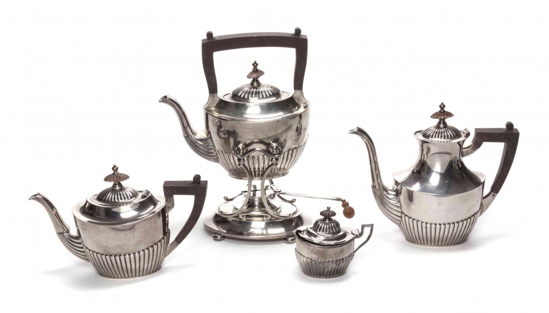 A Silver Tea and Coffee Service, Height overall of: A Silver Tea and Coffee Service, GORHAM MFG. CO., PROVIDENCE, RI, CIRCA 1935, comprising a kettle on stand, a teapot, and a coffee pot, each with wooden handles; together with a Black Starr & Frost li