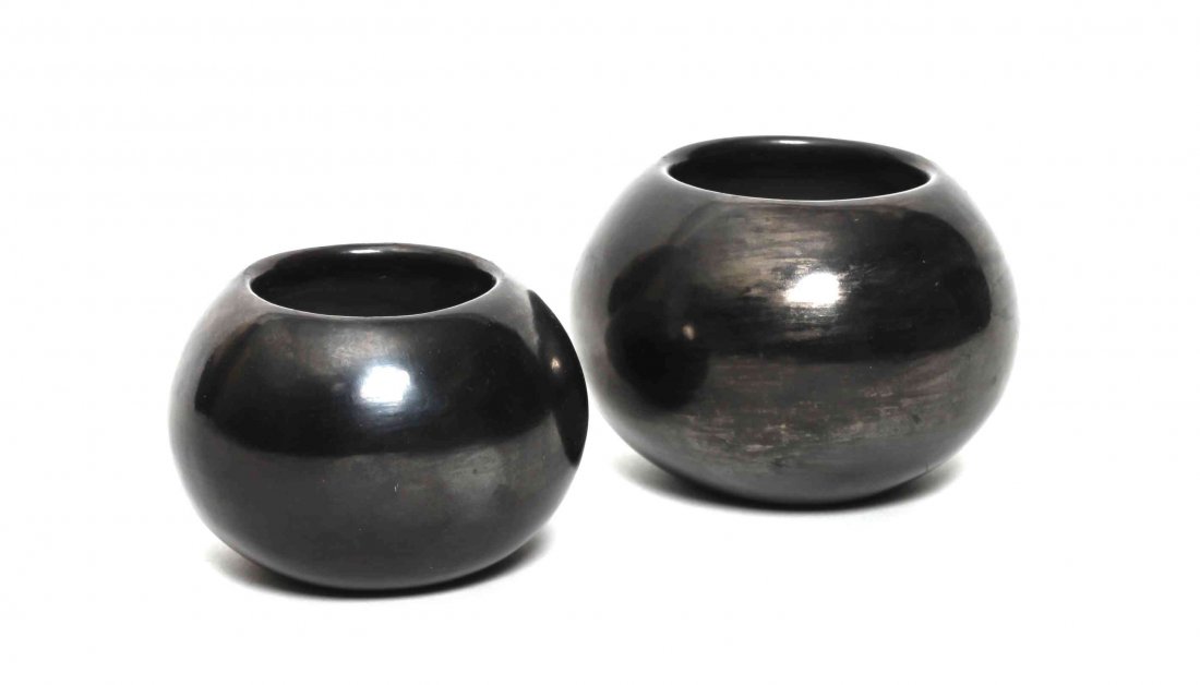 Popovi Da (1921-1971), San Ildefonso, Height of first 3: Popovi Da (1921-1971), San Ildefonso, an undecorated blackware pot, having gunmetal finish, signed "Popovi 965," together with an undecorated blackware pot, signed "Maria Poveka 7162." Height of first