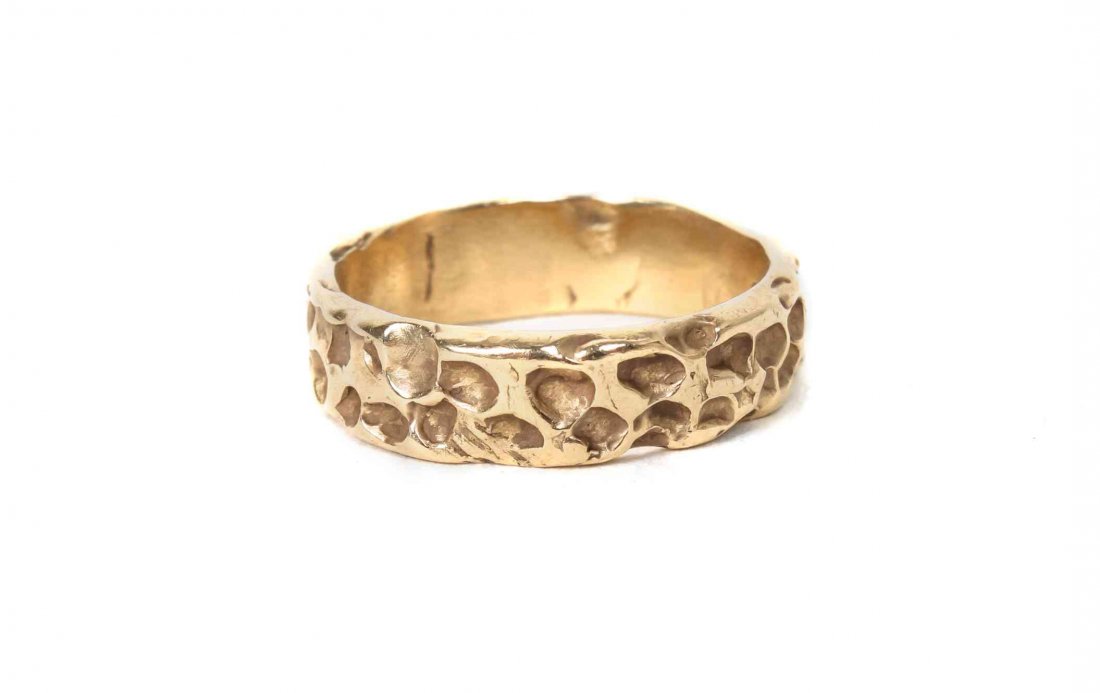 A 14 Karat Yellow Gold Sand-Cast Ring,: A 14 Karat Yellow Gold Sand-Cast Ring, marked 14K.