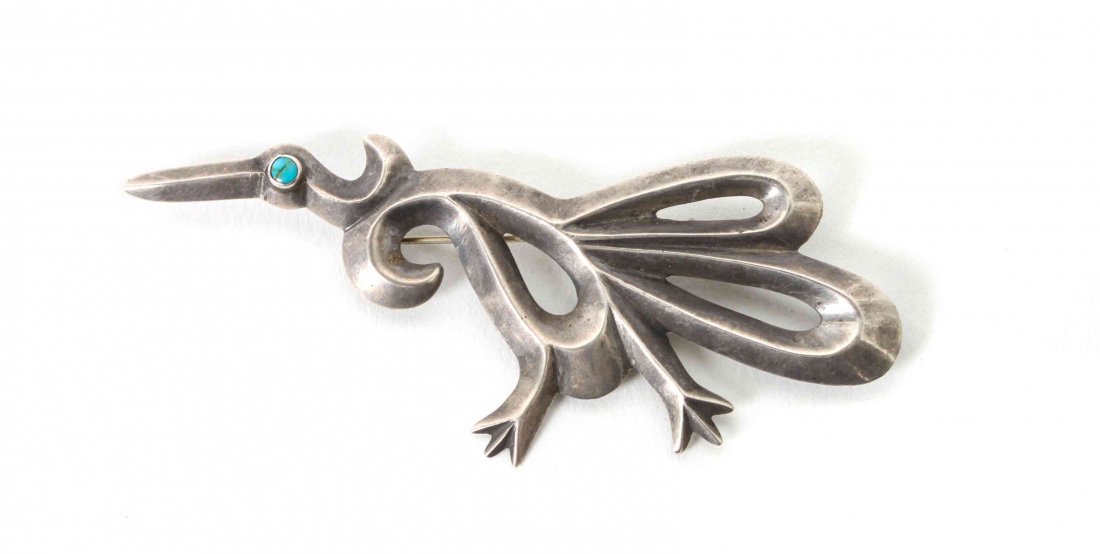 A Navajo Sand Cast Running Bird Pin, Length 3 1/2: A Navajo Sand Cast Running Bird Pin, having a turquoise eye. Length 3 1/2 inches. Property from the Collection of Linda Quinn, Manasquan, New Jersey