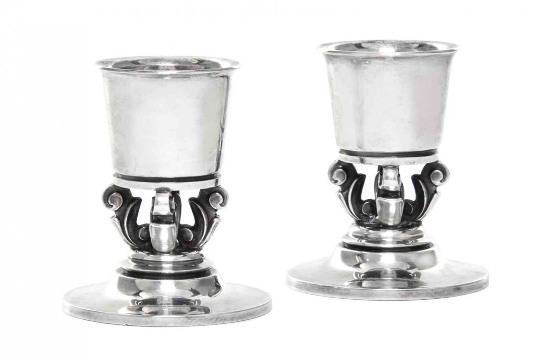 A Pair of Danish Silver Small Candlesticks, No 741,: A Pair of Danish Silver Small Candlesticks, No 741 Georg Jensen Silversmithy, Copenhagen, 1945-77 designed by Johan Rohde circa 1931, with tapered cylindrical sockets supported on openwork stems forme