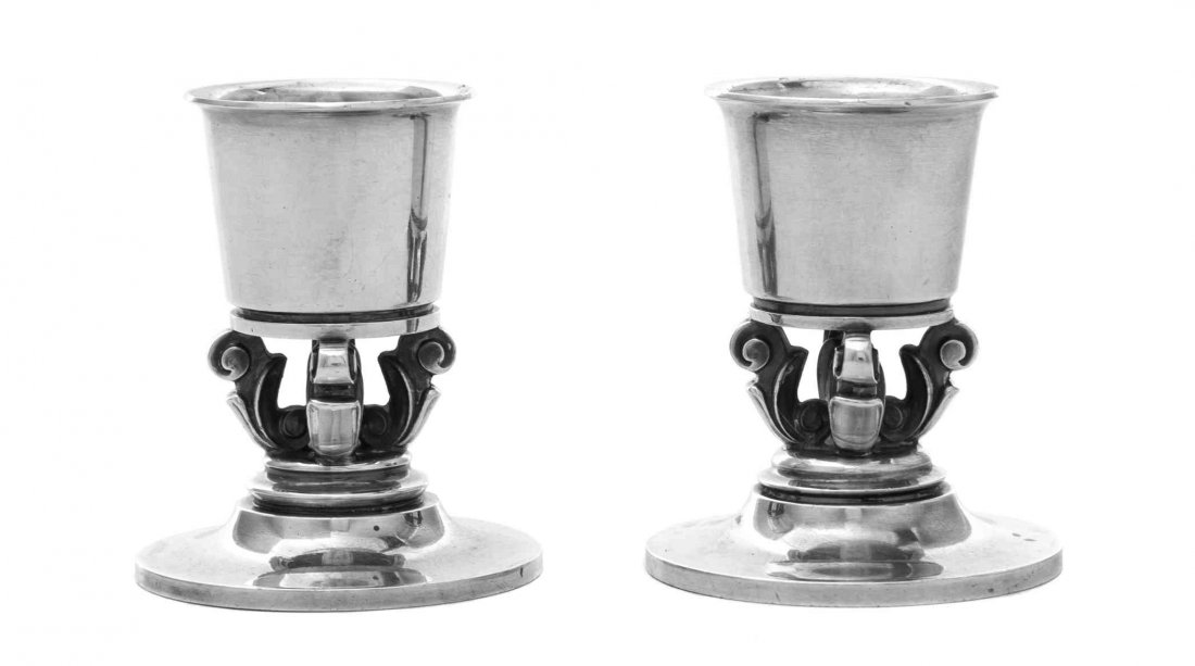 A Pair of Danish Silver Small Candlesticks, No. 741,: A Pair of Danish Silver Small Candlesticks, No. 741 Georg Jensen Silversmithy, Copenhagen, 1945-77 designed by Johan Rohde circa 1931, with tapered cylindrical sockets supported on openwork stems form