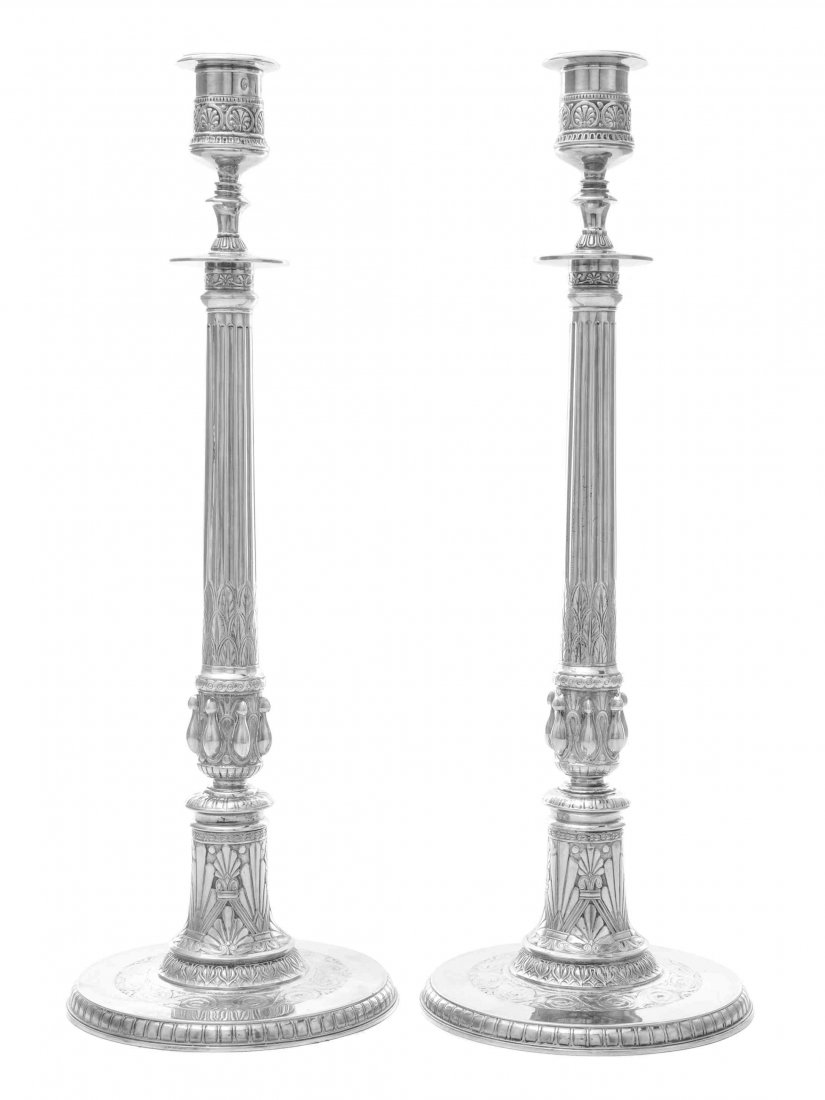 A Pair of Danish Silver Candlesticks, Assay Master: A Pair of Danish Silver Candlesticks Assay Master Simon Groth, Copenhagen, 1864 on flat circular bases with gadrooned borders, the tops flat-chased with bands of running scrolls, the lower stems with