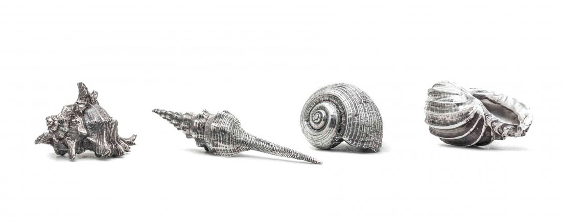 A Set of Four Italian Silver Shells, Maker's Mark M: A Set of Four Italian Silver Shells Maker's Mark M Under a Cross, Palermo, Late 20th Century each realistically cast as various seashells marked on sides 10 ozt 7 dwt Length of longest 4 1/8 inches Pr