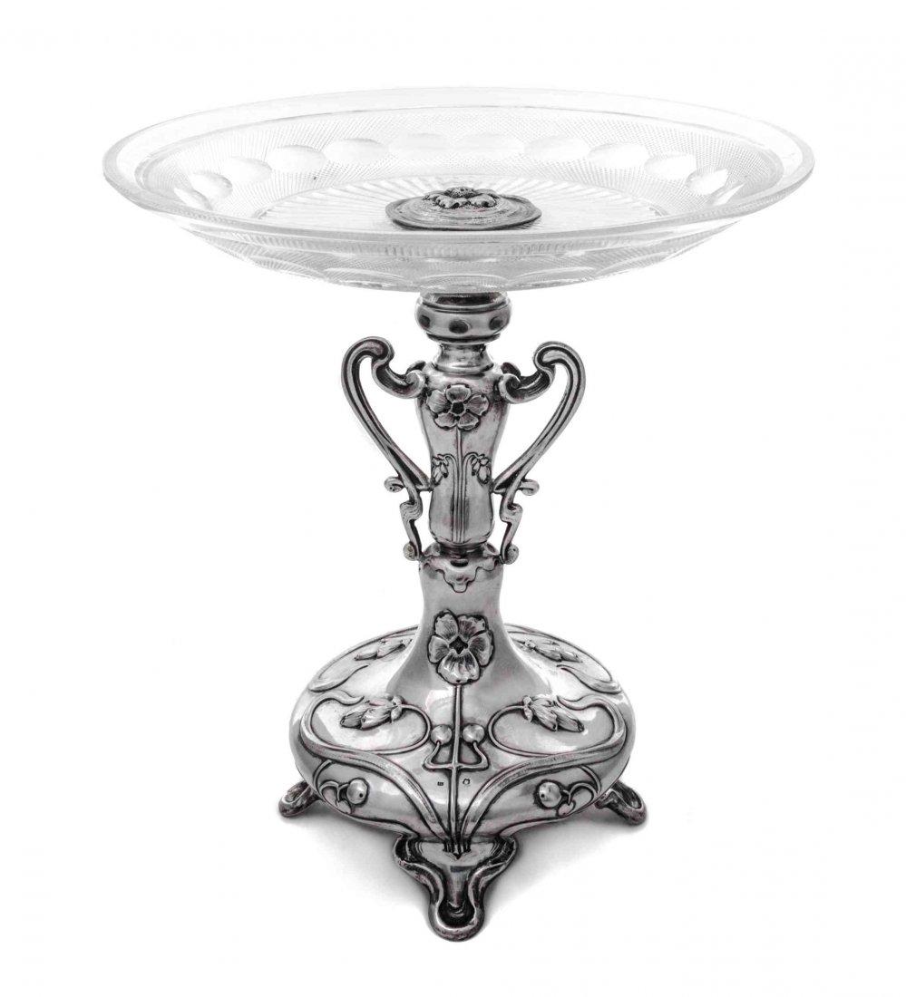 An Austrian Silver and Glass Compote, Theodore Klein,: An Austrian Silver and Glass Compote Theodore Klein, Vienna, Early 20th Century the domed circular base raised on four bracket supports and chased with whiplash flowers and foliage, rising to a balust