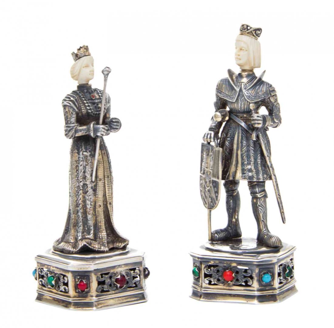 A Pair of German Parcel-Gilt Silver Figures of a Knight: A Pair of German Parcel-Gilt Silver Figures of a Knight and Lady Maker's Mark IES, Late 19th Century both dressed in Renaissance costume, she with a sceptre and he with a sword and shield, on shaped s