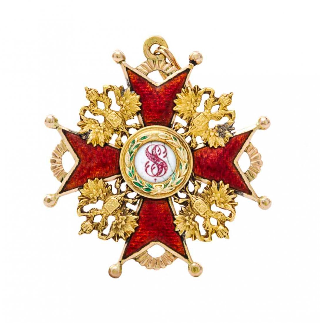 A Russian Gold, Silver-Gilt and Enamel Order of St.: A Russian Gold, Silver-Gilt and Enamel Order of St. Stanislaus Late 19th/Early 20th Century 3rd class, the obverse with translucent red enamel cross centered by a green enamel laurel wreath enclosing