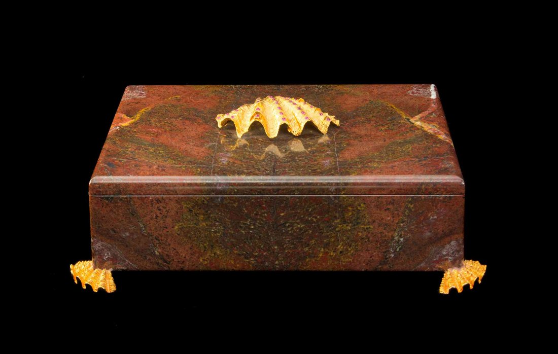 An Italian Silver-Gilt and Ruby-Mounted Large Marble: An Italian Silver-Gilt and Ruby-Mounted Large Marble Box Nardi, Venice, 20th Century the rectangular marble body raised on silver-gilt feet fully modeled as clam shells, the hinged cover mounted in ce