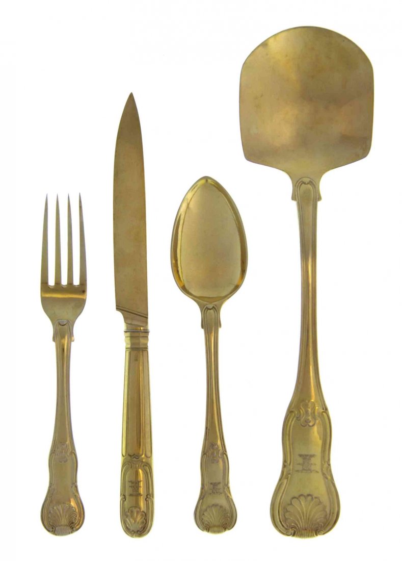 A George III Silver-Gilt Dessert Flatware Service,: A George III Silver-Gilt Dessert Flatware Service Eley, Fern & Chawner, London, 1808 Hourglass pattern, engraved with crest, comprising 18 fruit knives, Moses Brent, London, 1807 18 dessert forks 18 d