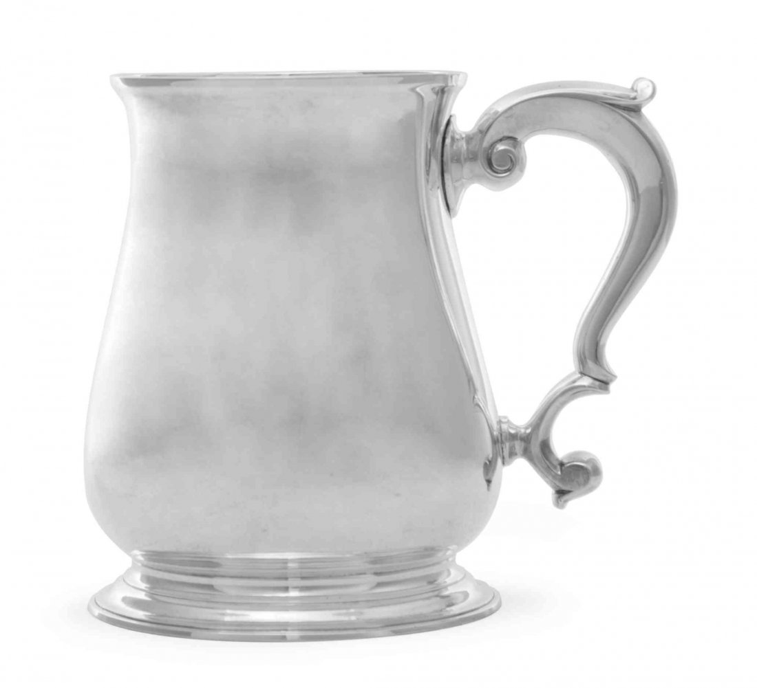 A George II Silver Cann, Richard Gurney & Thomas Cook,: A George II Silver Cann Richard Gurney & Thomas Cook, London, 1743 of baluster form with flaring rim and capped double-scroll handle, raised on a moulded foot rim, the underside with contemporary bloc