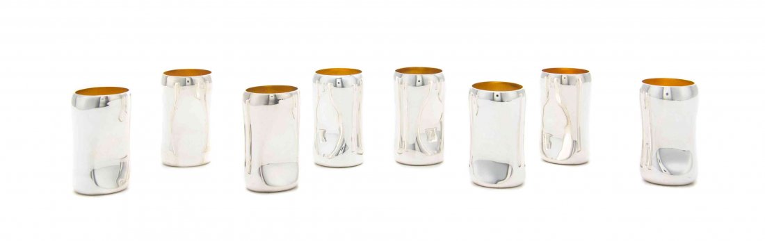 A Set of Eight Italian Silver Cordials, Elsa Peretti: A Set of Eight Italian Silver Cordials Elsa Peretti for Tiffany & Co., New York, NY, Late 20th Century Thumbprint pattern, cylindrical with concave sides, gilt interiors marked on undersides 6 ozt 10 