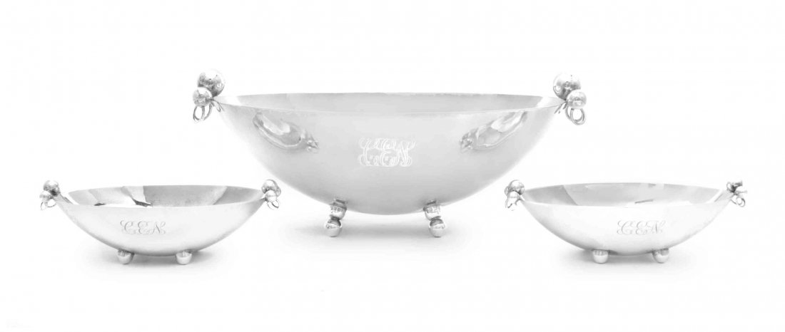 A Set of Three American Silver Bowls, Alfred Sciarrotta: A Set of Three American Silver Bowls Alfred Sciarrotta for Black, Starr & Gorham, Providence, RI, Mid 20th Century comprising one large bowl and a pair of small bowls, all oval raised on four ball fee