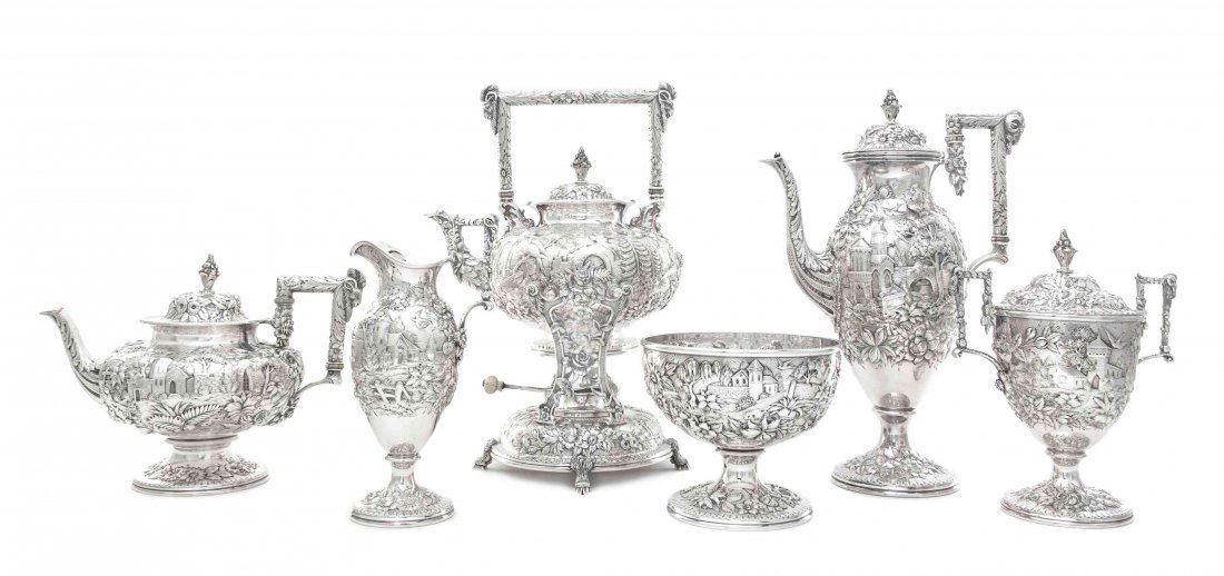 An American Silver Six-Piece Tea and Coffee Set, S.: An American Silver Six-Piece Tea and Coffee Set S. Kirk & Son, Baltimore, MD, Circa 1915 comprising a teapot, coffee pot, kettle on lampstand, creamer, covered sugar bowl and waste bowl, the circular