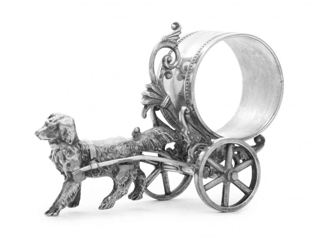 An American Silver-Plate Figural Napkin Ring, Simpson,: An American Silver-Plate Figural Napkin Ring Simpson, Hall, Miller & Co., Wallingford, CT, 2nd Half 19th Century formed as dog pulling a cart, the ring engraved with a floral spray marked on underside