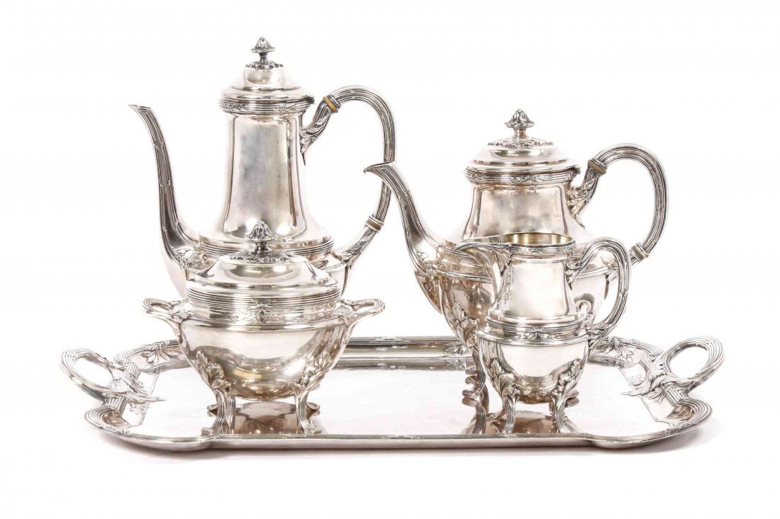 A French Silver-Plate Four-Piece Tea and Coffee Set Hei: A French Silver-Plate Four-Piece Tea and Coffee Set Christofle, Paris, comprising a teapot, coffee pot, creamer, and sugar bowl, with tray, having reeded supports with foliated designs ending in scrol