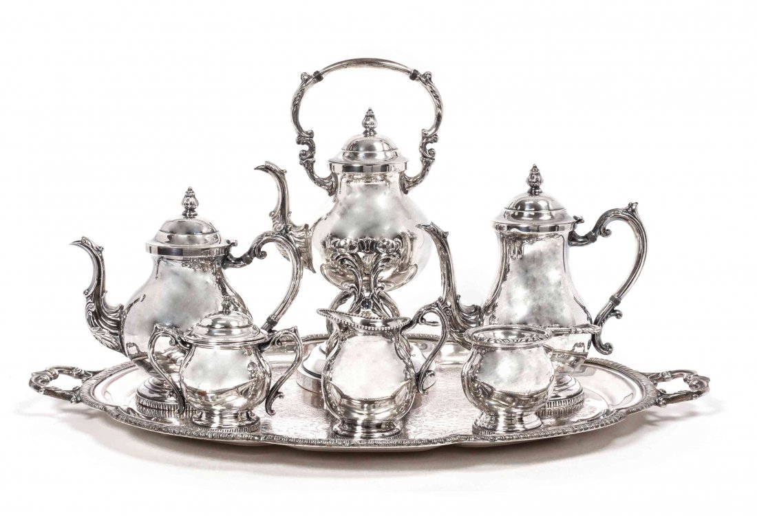 An American Silver-Plate Coffee and Tea Service, Height: An American Silver-Plate Coffee and Tea Service, F. B. Rogers Silver Co., Taunton, MA, comprising a teapot, coffee pot, kettle on lamptsand, creamer, sugar, and tea strainer, with associated tray, 7 i