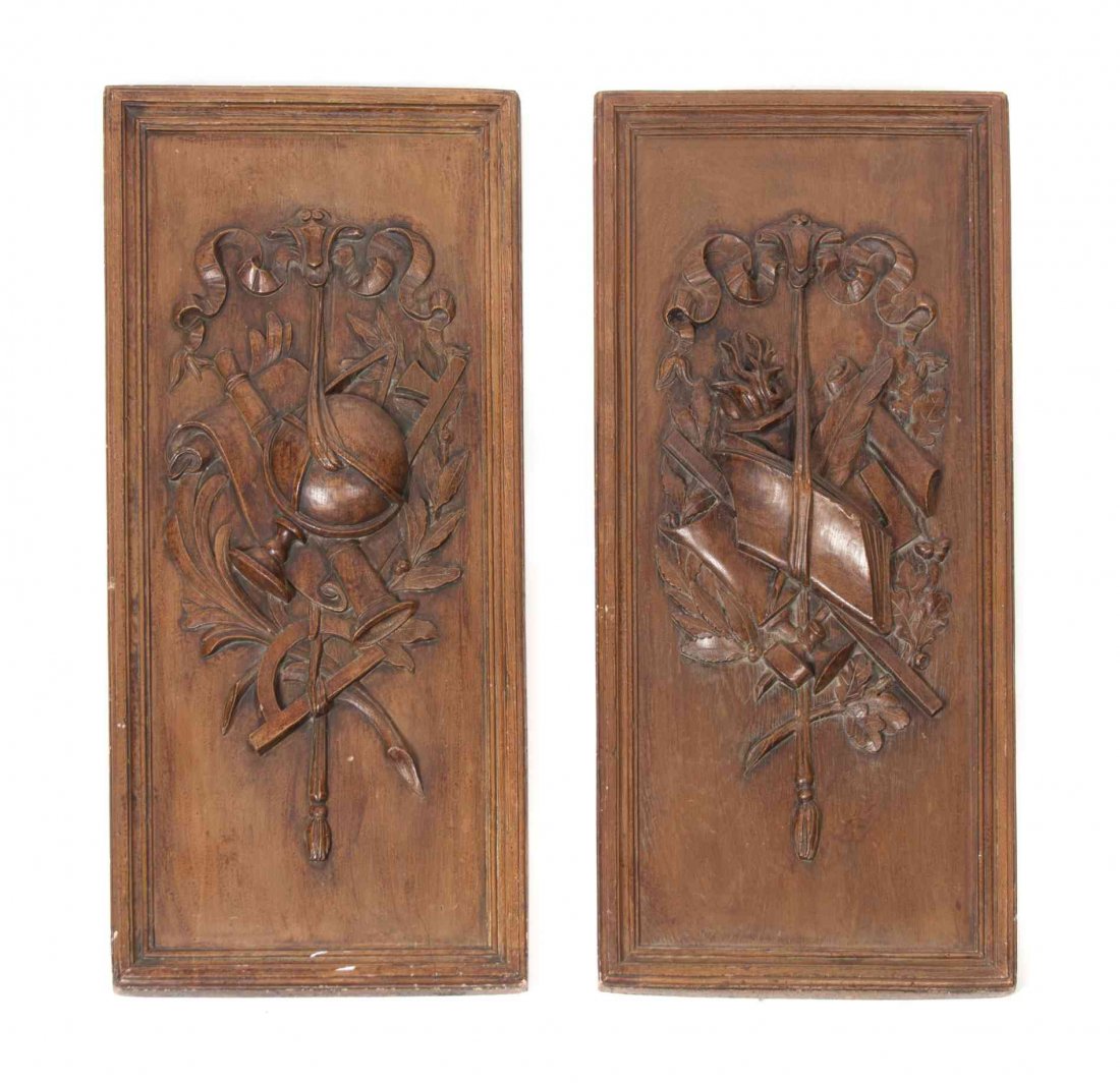 A Pair of French Faux-Painted Plaster Plaques, Height: A Pair of French Faux-Painted Plaster Plaques, one worked to show a trophy emblematic of literature, the other a trophy emblematic of science. Height 30 x width 14 inches.
