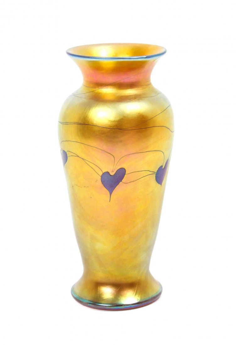 An Iridescent Glass Vase, Height 8 1/8 inches.: An Iridescent Glass Vase, of baluster form decorated heart motif, with spurious Tiffany marks. Height 8 1/8 inches. Condition: In nice, clean condition.
