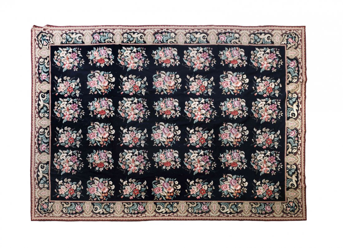 A Needlepoint Rug, 10 feet x 14 feet.: A Needlepoint Rug, with black and floral design. 10 feet x 14 feet. Condition: In nice condition