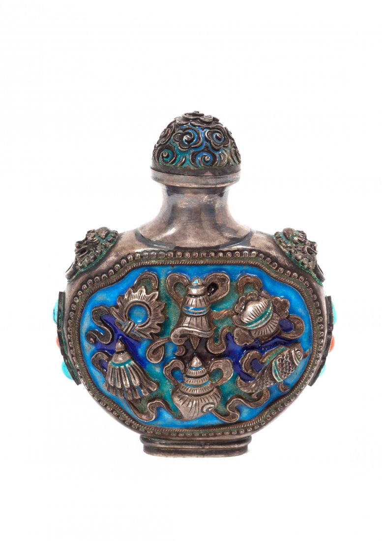 A Tibetan Enameled and Silver Snuff Bottle, Height 3: A Tibetan Enameled and Silver Snuff Bottle, depicting the bajixiang Buddhist emblems. Height 3 1/4 inches. Property from the Estate of Dr. Fred A. Goldberg, Memphis, Tennessee
