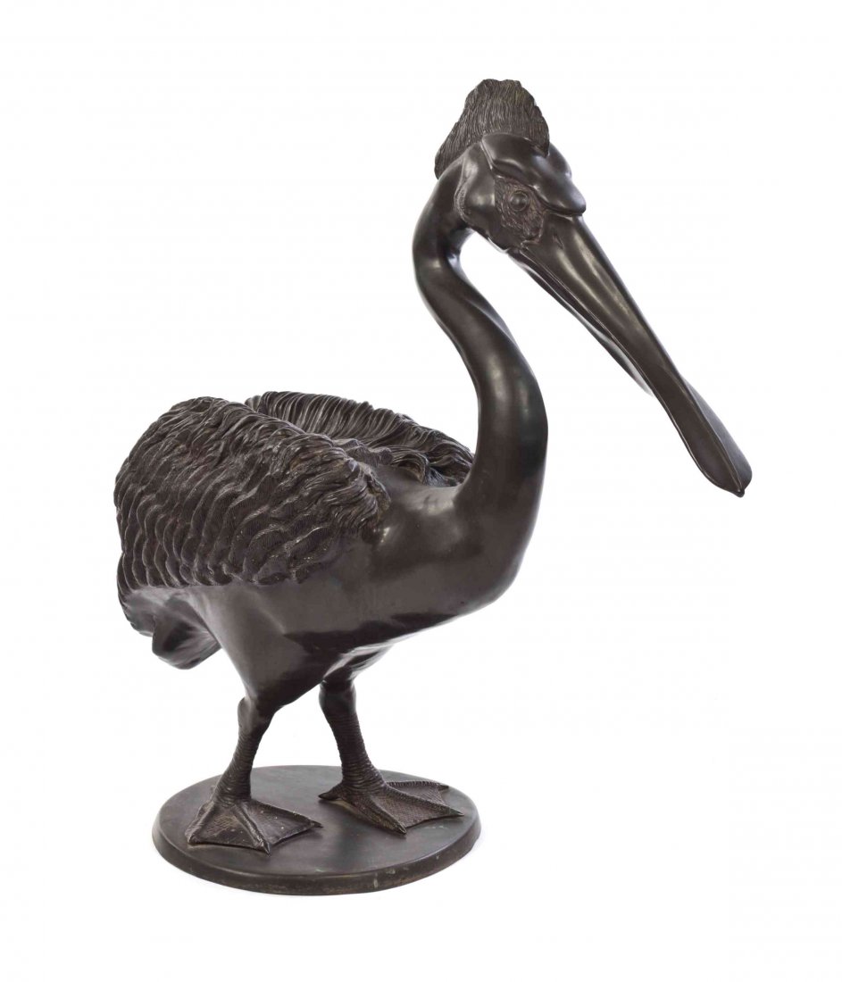 A Cast Metal Ornithological Figure, Height 33 1/4: A Cast Metal Ornithological Figure, depicting a pelican, set on an oval base. Height 33 1/4 inches.