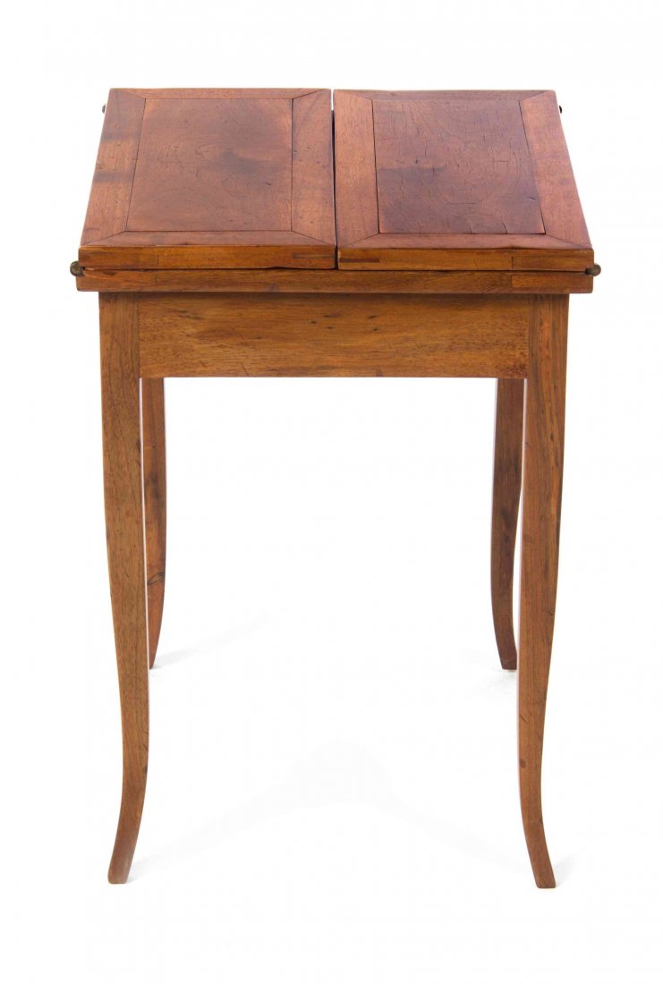 An Italian Walnut Work Table, Height 21 1/2 x width 15: An Italian Walnut Work Table, with a square top and rectangular leaves, raised on slightly splayed legs. Height 21 1/2 x width 15 1/4 x depth 15 1/4 inches.