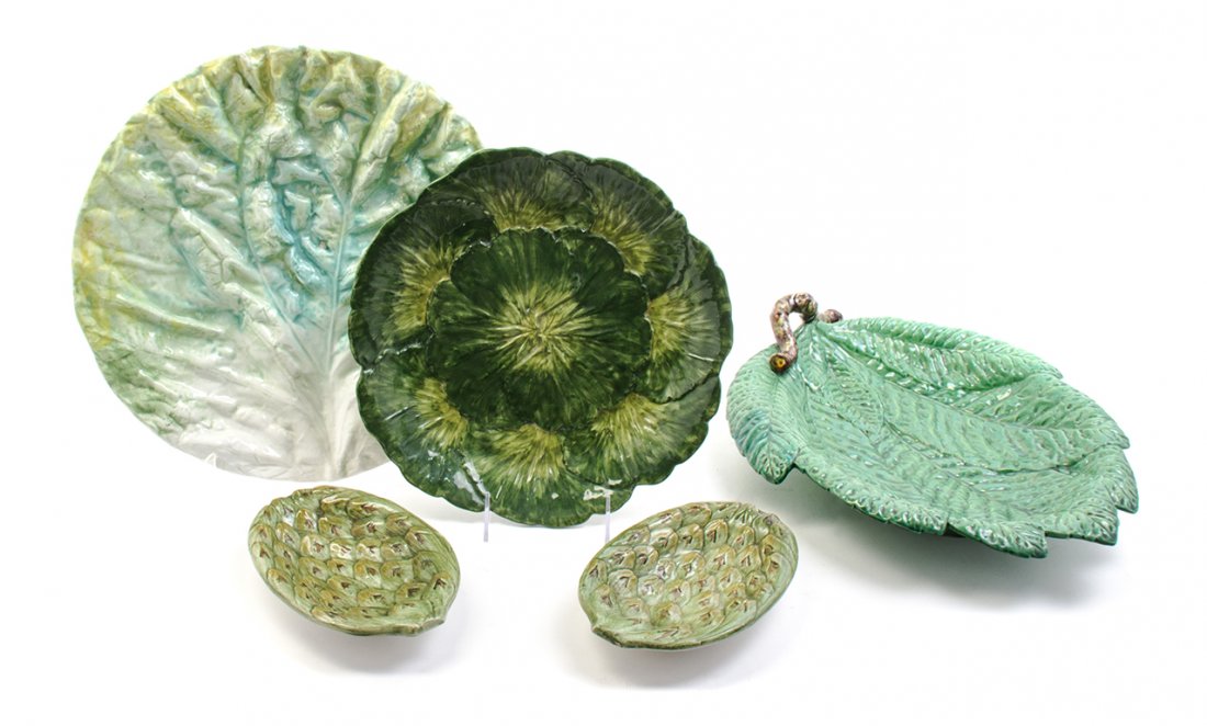 An Assembled Collection of Cabbage Form Dinnerware, Wid: An Assembled Collection of Cabbage Form Dinnerware, comprising sixteen plates, three trays, a rectangular serving bowl and two additional dishes. Width of widest 15 1/2 inches.