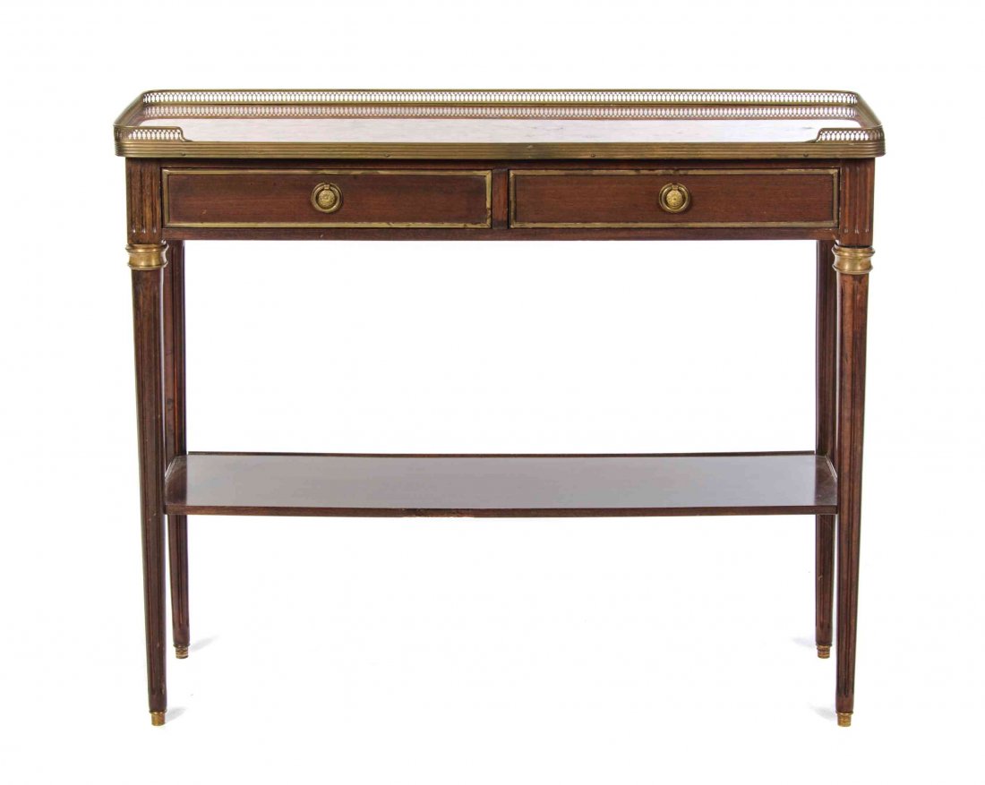 A Louis XVI Style Gilt Metal Mounted Console Table,: A Louis XVI Style Gilt Metal Mounted Console Table, having a rectangular three-quarter galleried top above two drawers, raised on fluted tapering legs joined by a medial shelf. Height 31 x width 37 1/