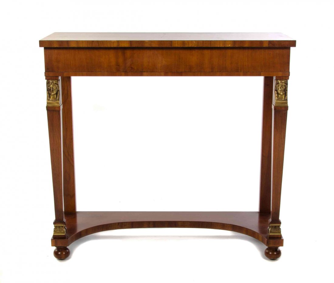 An Empire Style Gilt Metal Mounted Console Table,: An Empire Style Gilt Metal Mounted Console Table, with a rectangular marble top over a plain frieze, raised on tapering supports headed by female busts and joined by a medial shelf over spherical feet