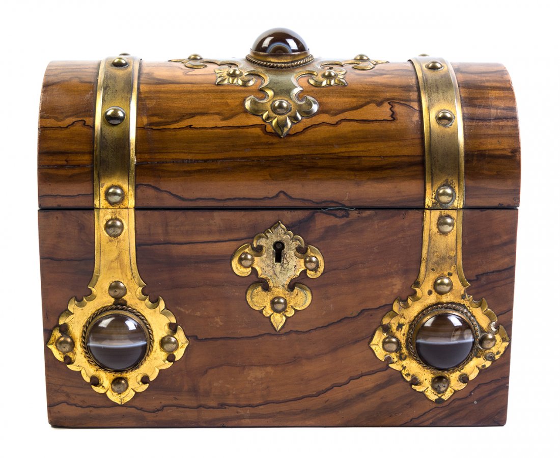 A Brass Banded Calamander Table Casket, Width 8 5/8: A Brass Banded Calamander Table Casket, having a domed rectangular top opening to a velvet-lined interior, the case further set with three cabochons. Width 8 5/8 inches.