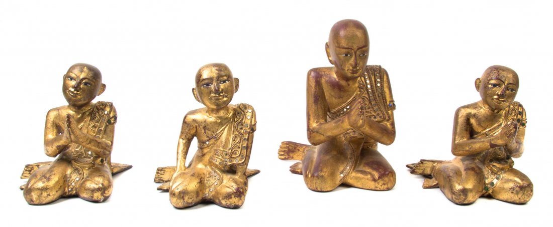 Four Indonesian Giltwood Figures of Buddhist Disciples,: Four Indonesian Giltwood Figures of Buddhist Disciples, each depicted seated at prayer, raised on associated stands. Height of tallest 9 inches.