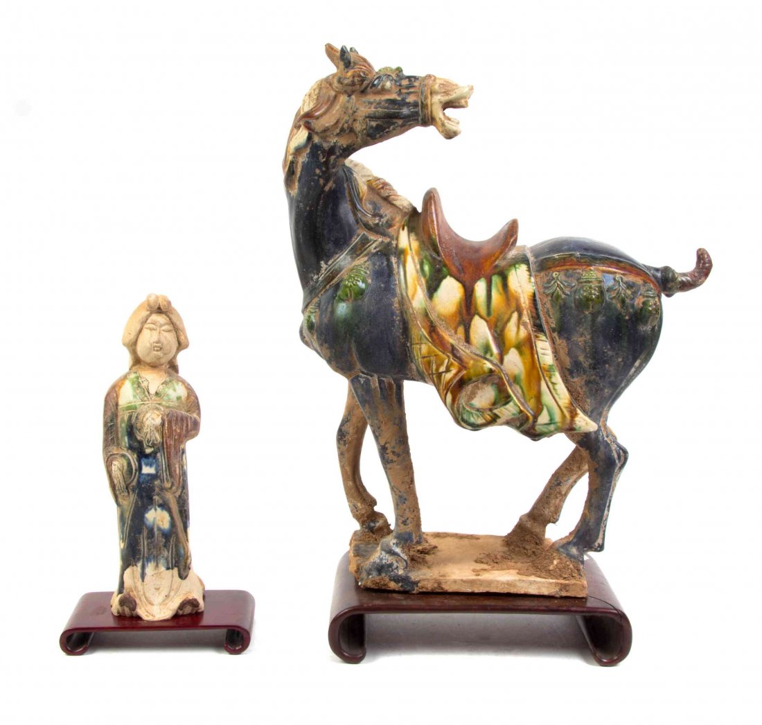 Two Tang Style Figures, Width of first 14 inches.: Two Tang Style Figures, the first a model of a caparisoned horse, the second a standing robed fat lady. Width of first 14 inches.
