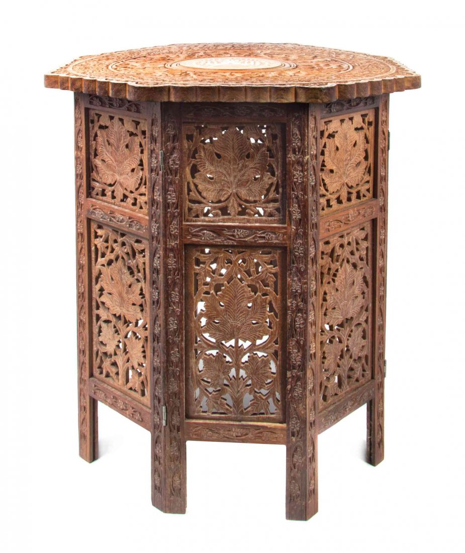 A Middle Eastern Bone Inset Hardwood Occasional Table,: A Middle Eastern Bone Inset Hardwood Occasional Table, centered with a scene of the Taj Mahal amidst a grapevine border. Height 22 1/4 x diameter 21 3/4 inches.