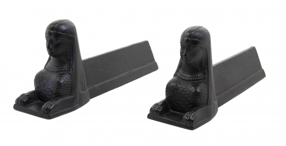 A Pair of Egyptian Revival Cast Iron Andirons, Length: A Pair of Egyptian Revival Cast Iron Andirons, each in the form of a female bust. Length 15 3/4 inches.