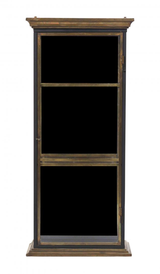 A Brass Table Vitrine, Height 36 1/4 x width 16 1/4 x: A Brass Table Vitrine, having one glazed door opening to a mirrored interior. Height 36 1/4 x width 16 1/4 x depth 8 1/2 inches.