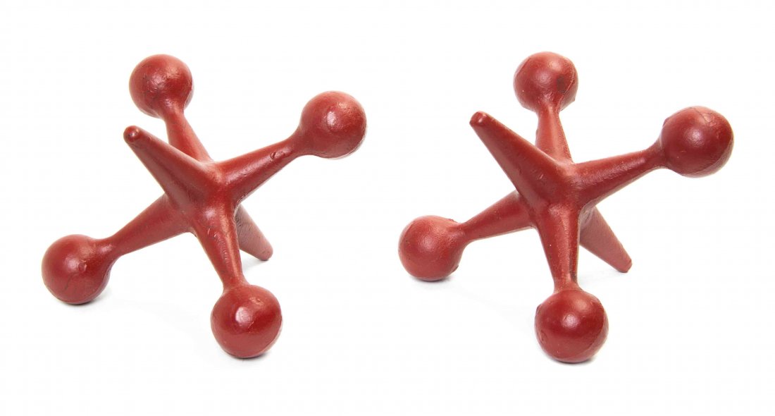 A Pair of Oversize Cast Iron Jacks, Width 7 1/2 inches.: A Pair of Oversize Cast Iron Jacks, each painted red. Width 7 1/2 inches.