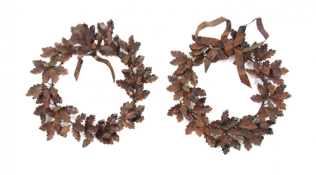 A Pair of Tole Wreaths, Height 13 1/2 inches.: A Pair of Tole Wreaths, each with a tied ribbon crest. Height 13 1/2 inches.