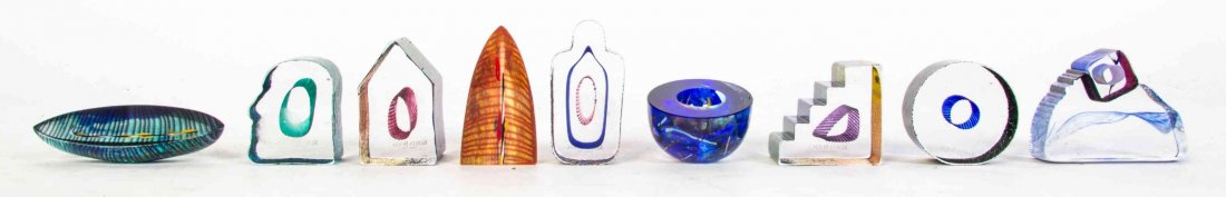 A Set of Nine Kosta Boda Glass Mini Sculptures,: A Set of Nine Kosta Boda Glass Mini Sculptures, designed by Bertil Vallien, comprising the following examples, Country Living, Sarcophagus, In the Stone, Roundabout, Entrance, Bowl, Journey, Stand Tal