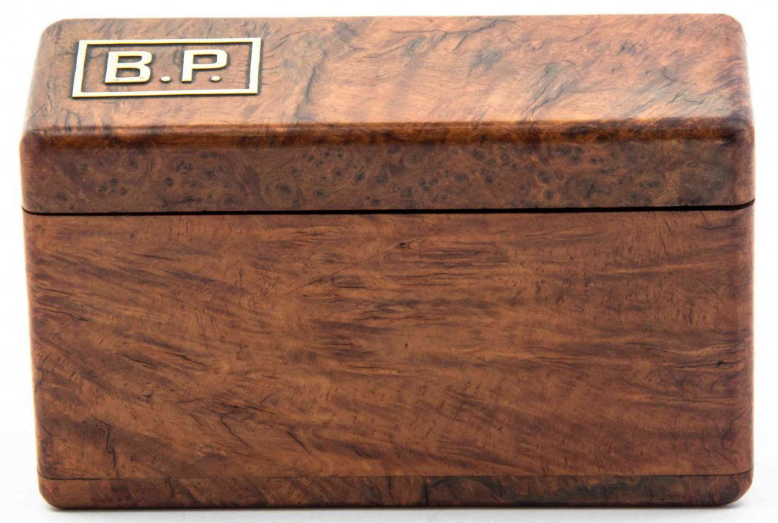 A Brass Inlaid Burlwood Cigar Box, Height 3 3/4 x width: A Brass Inlaid Burlwood Cigar Box, the exterior inlaid with the initials B.P., opening to a fitted interior for 48 cigars. Height 3 3/4 x width 6 1/4 x depth 2 3/4 inches. Property from the Collection
