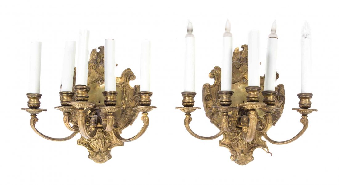 A Pair of Neoclassical Style Gilt Bronze Five-Light: A Pair of Neoclassical Style Gilt Bronze Five-Light Sconces, each backplate cast to show an eagle and a mask. Height 15 1/4 inches. Property from the Estate of a Prominent Midwest Collector