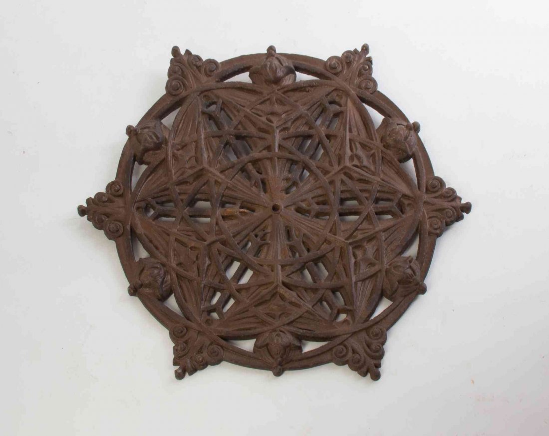 A Cast Iron Elevator Grill Medallion, after the Louis: A Cast Iron Elevator Grill Medallion, after the Louis Sullivan example for the Guaranty Building, 4th quarter 20th century, of shaped circular form with repeating oval and floral decoration, with an e