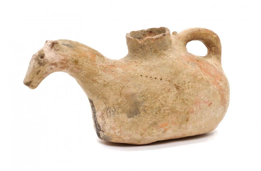 A Middle Eastern Earthenware Jug, Length 10 1/4 inches.: A Middle Eastern Earthenware Jug, having a horsehead spout. Length 10 1/4 inches.