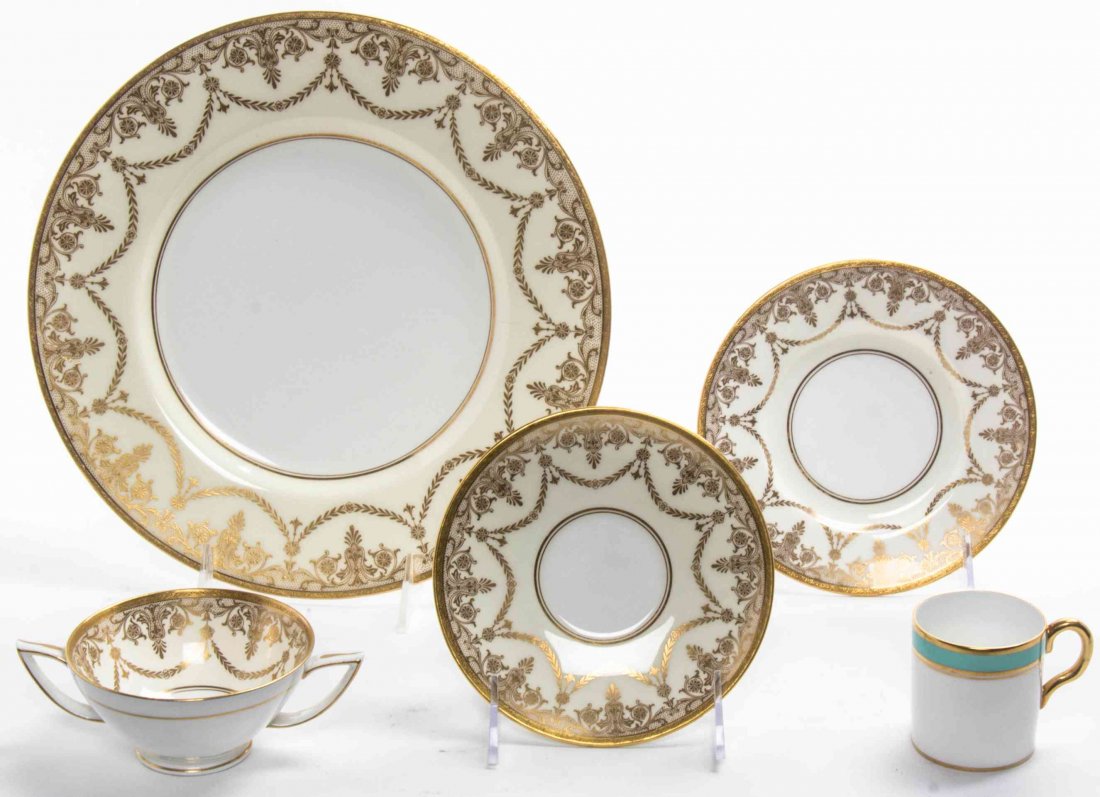 A Minton Partial Porcelain Dinner Service, Diameter of: A Minton Partial Porcelain Dinner Service, comprising 12 saucers, 6 cups and 6 dinner plates, together with 9 Royal Chelsea coffee cups; 33 items total. Diameter of dinner plates 10 3/4 inches.