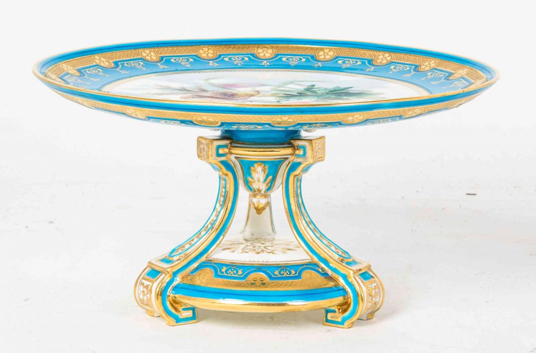 A Sevres Style Gilt Porcelain Tazza, Height 5 x: A Sevres Style Gilt Porcelain Tazza, the circular dish painted to show a moth on a floral spray, raised on a tripod base. Height 5 x diameter 9 1/2 inches. Property from the Estate of Mary Anne Kirchs