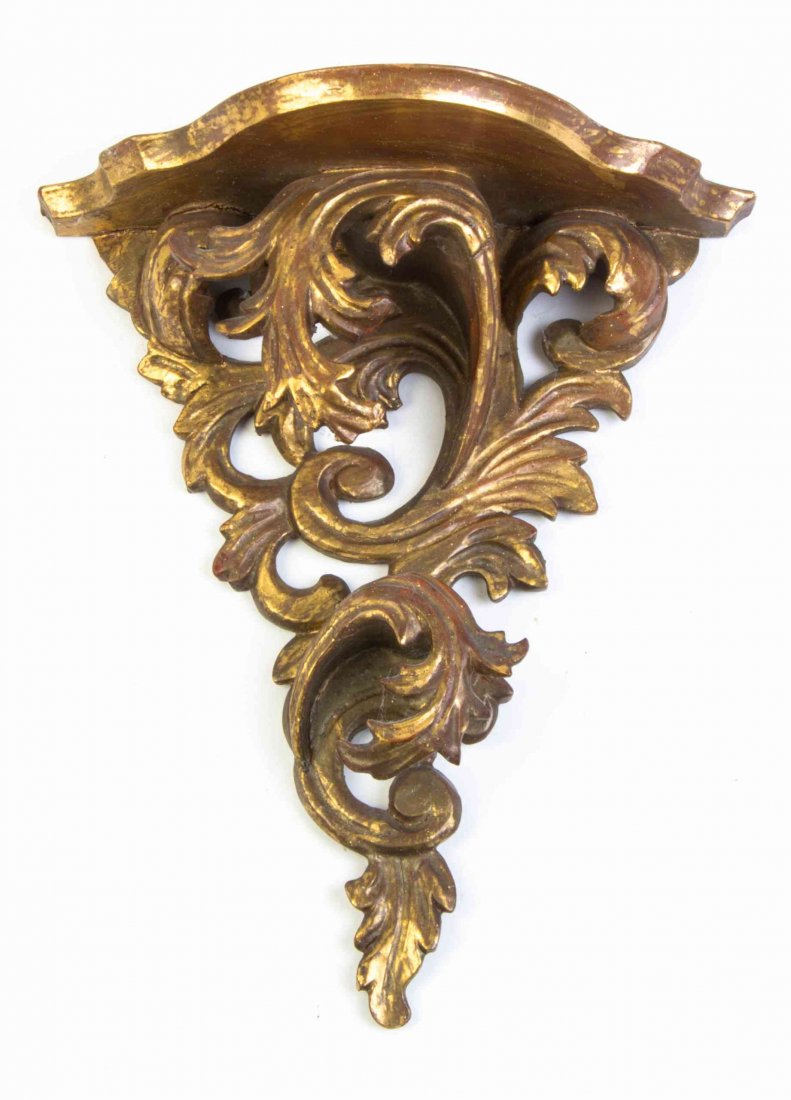 A Louis XV Style Giltwood Wall Bracket, Height 11: A Louis XV Style Giltwood Wall Bracket, with a shaped shelf. Height 11 inches.