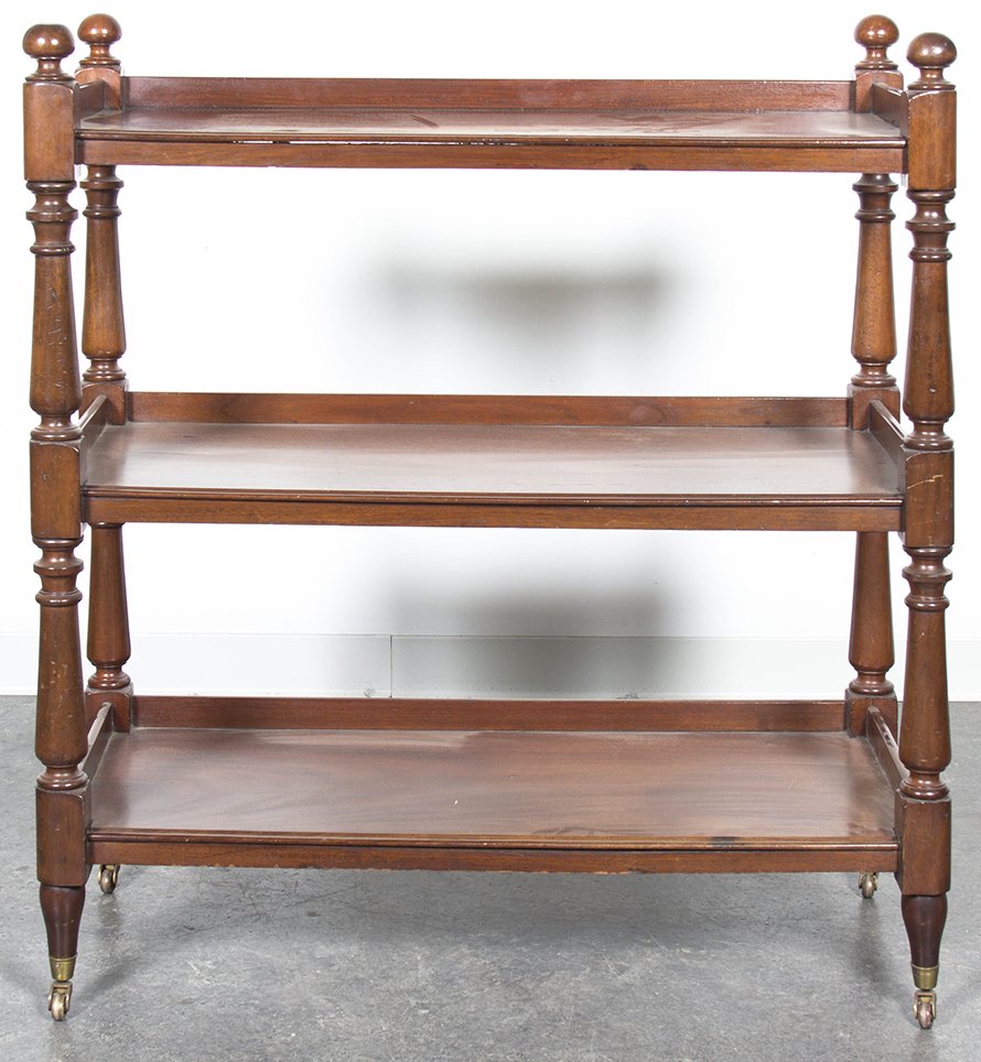 An English Mahogany Etegere, Height 44 1/2 x width 39 x: An English Mahogany Etegere, of rectangular form, the three-quarter galleried top with ball finials over three shelves raised on turned supports, ending in casters. Height 44 1/2 x width 39 x depth 16